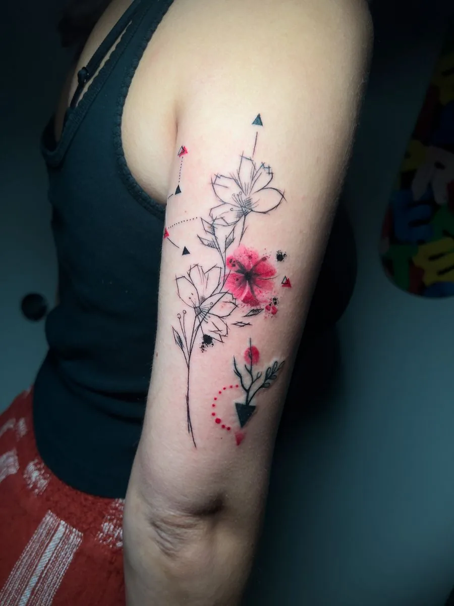 Fine line tattoo with touches of color: flowers and arrows, on the arm